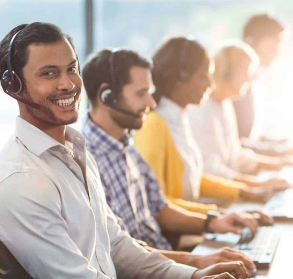 Agents working on their headset at a customer support outsourcing company